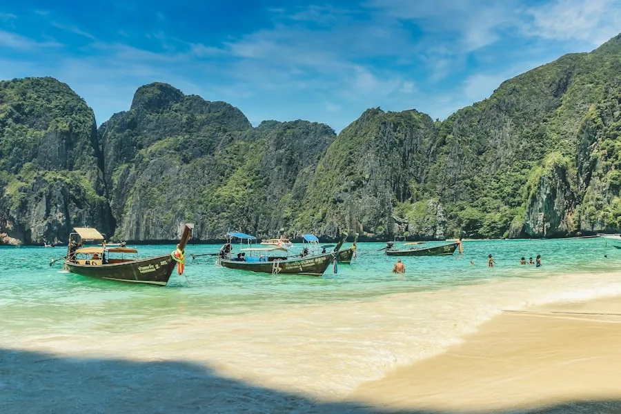 Travelers on a longtail boat exploring the Thai coastline
